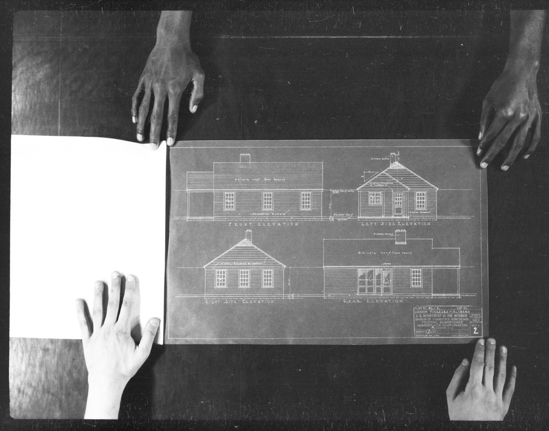 Black and white photo of elevational blueprints of a house.